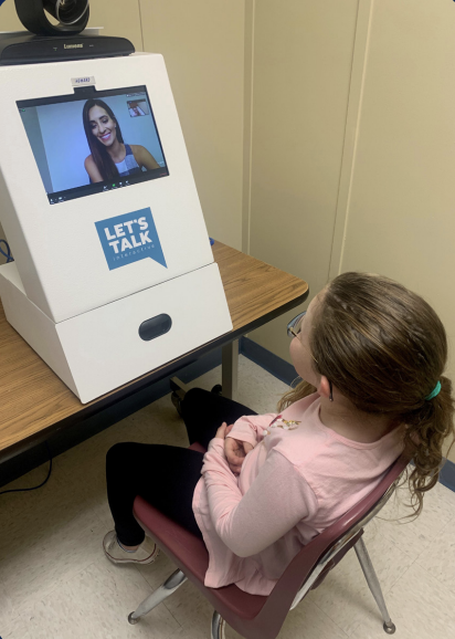 A student uses a custom kiosks from Let's Talk Initiative