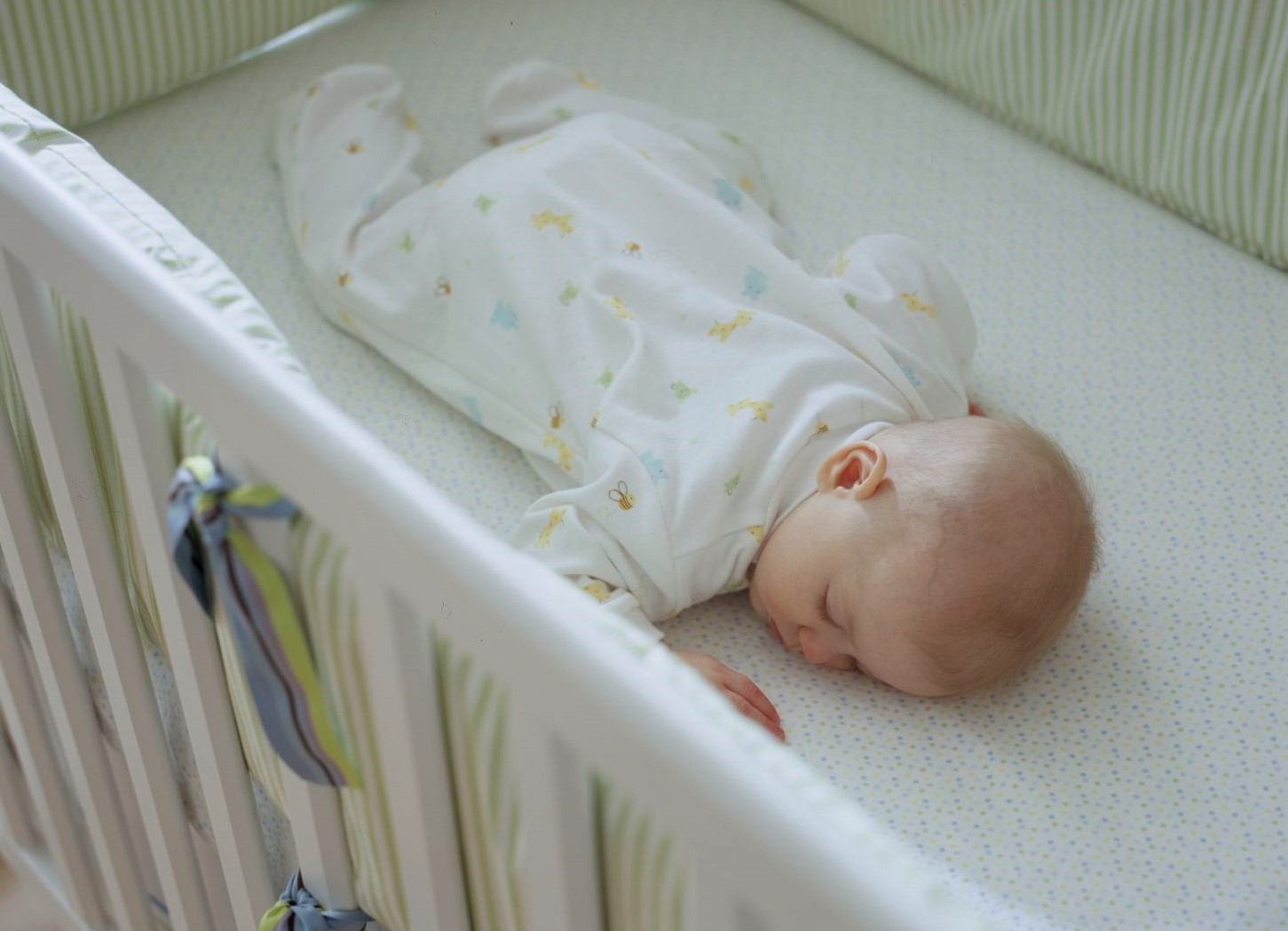 Baby sleeping incorrectly, on tummy