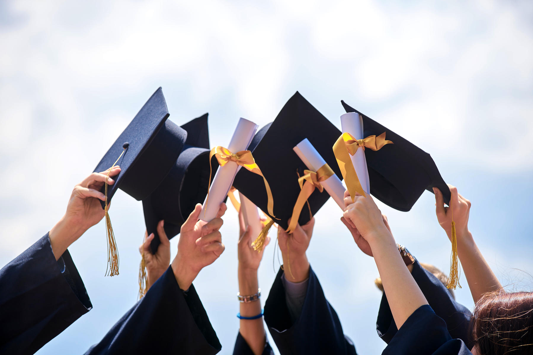 Graduation Ceremony Hats and Diplomas Thrown in Air