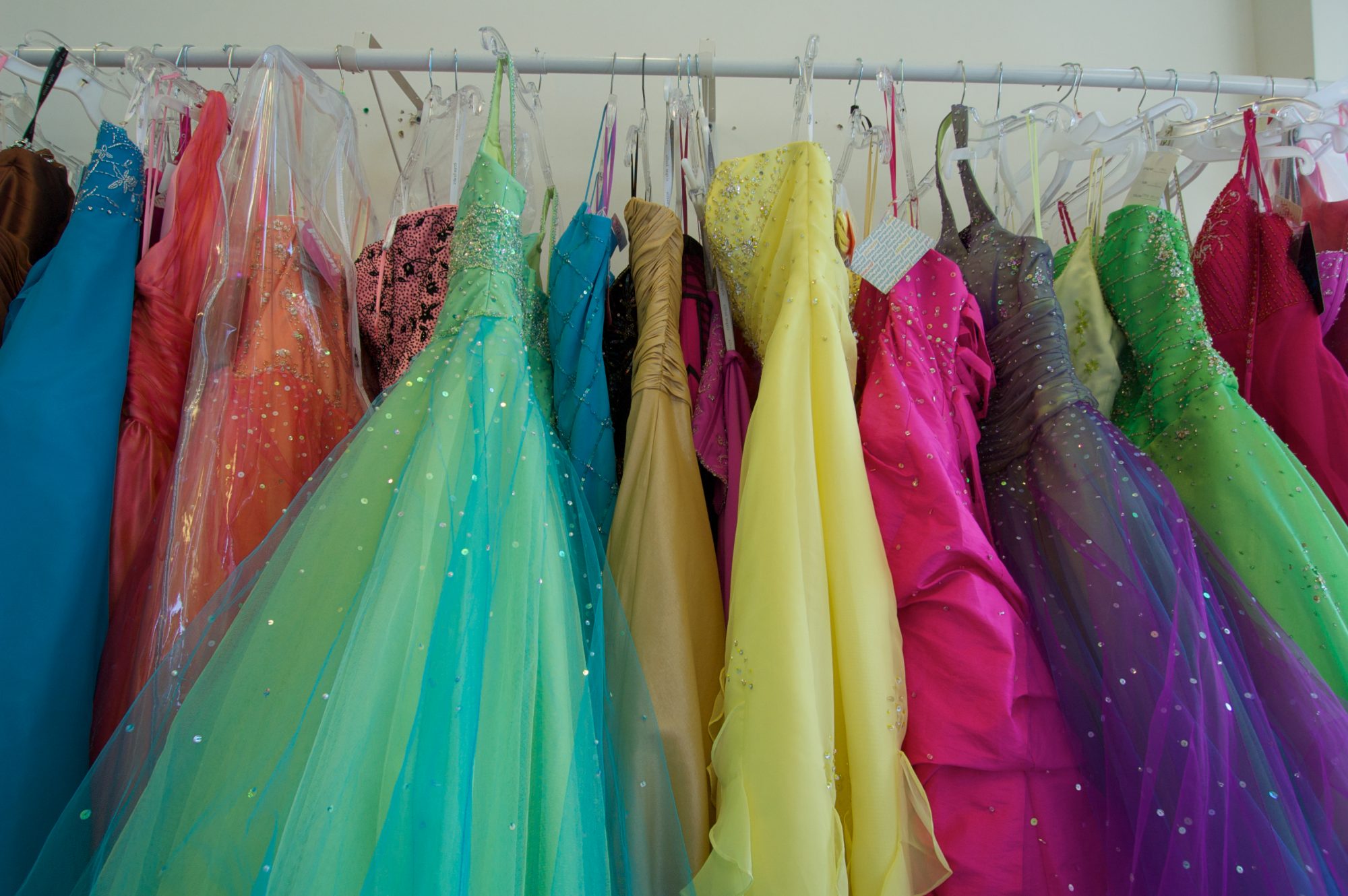 Colorful Prom Gowns Hanging on Rack