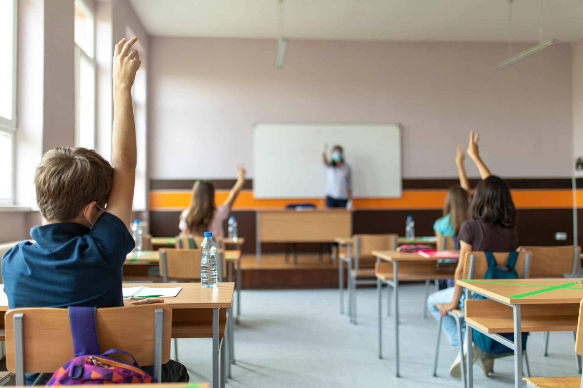 An image of a teacher speaking with her classroom.