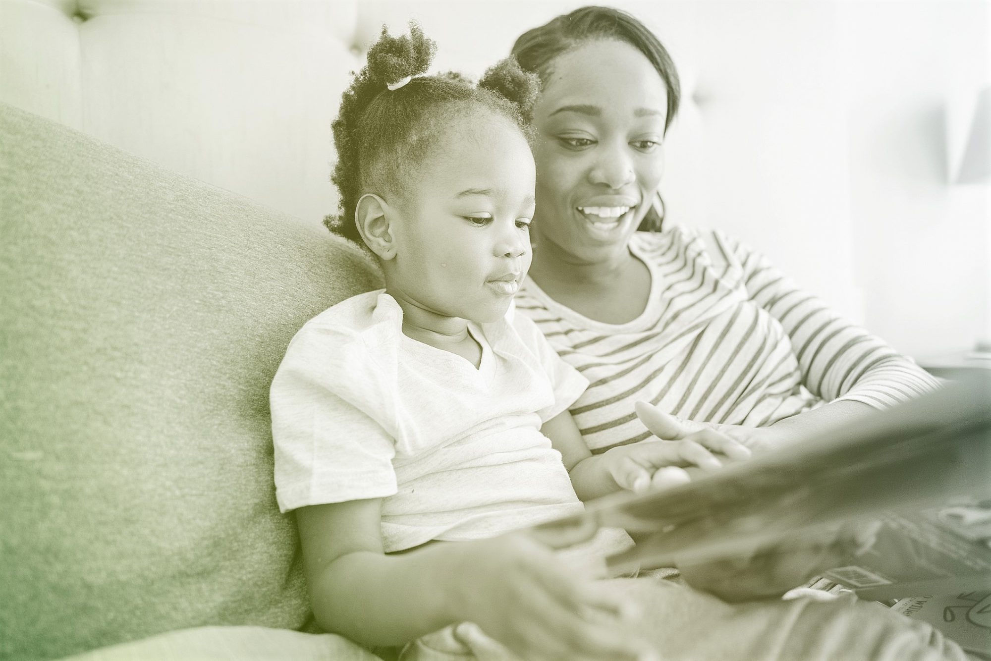 mother reading book to child